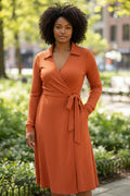 Lady Bear Resale coral textured long sleeve wrap dress with tie waist and collar. Size small.