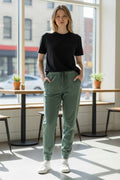 Lady Bear Resale green cotton blend joggers with drawstring waist and pockets, size XS.