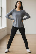 Lady Bear Resale grey Athleta long sleeve shirt, size small, with a split back hem and ribbed neckline detail.