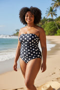 Lady Bear Resale navy blue and white polka dot bandeau bathing suit, size 8. Features ruching detail.